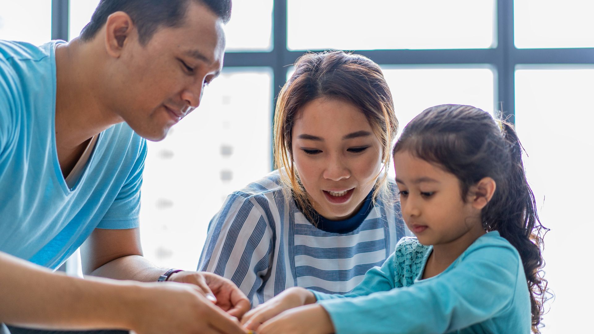 parents helping their child study